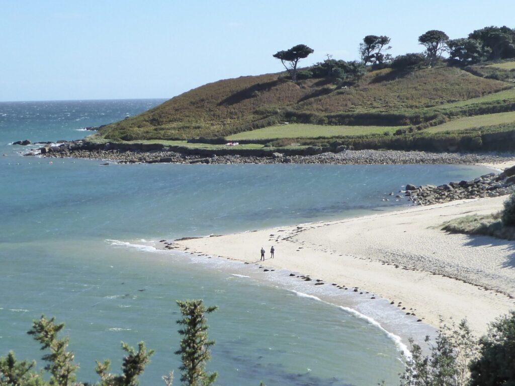view of sandy beach and headland at Pelistry beach Isles of Scilly