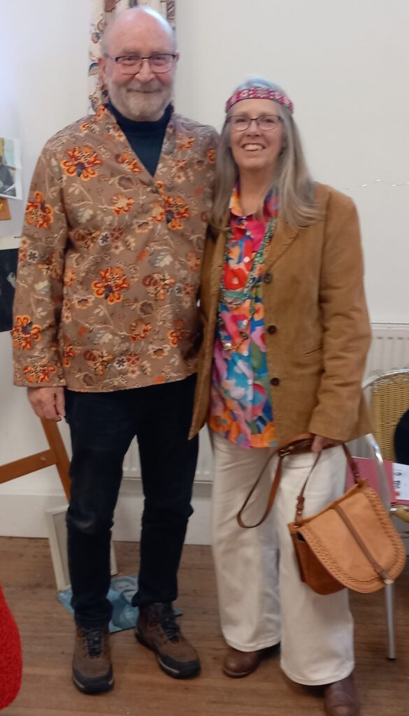 Man and a woman dressed in 60's style clothes